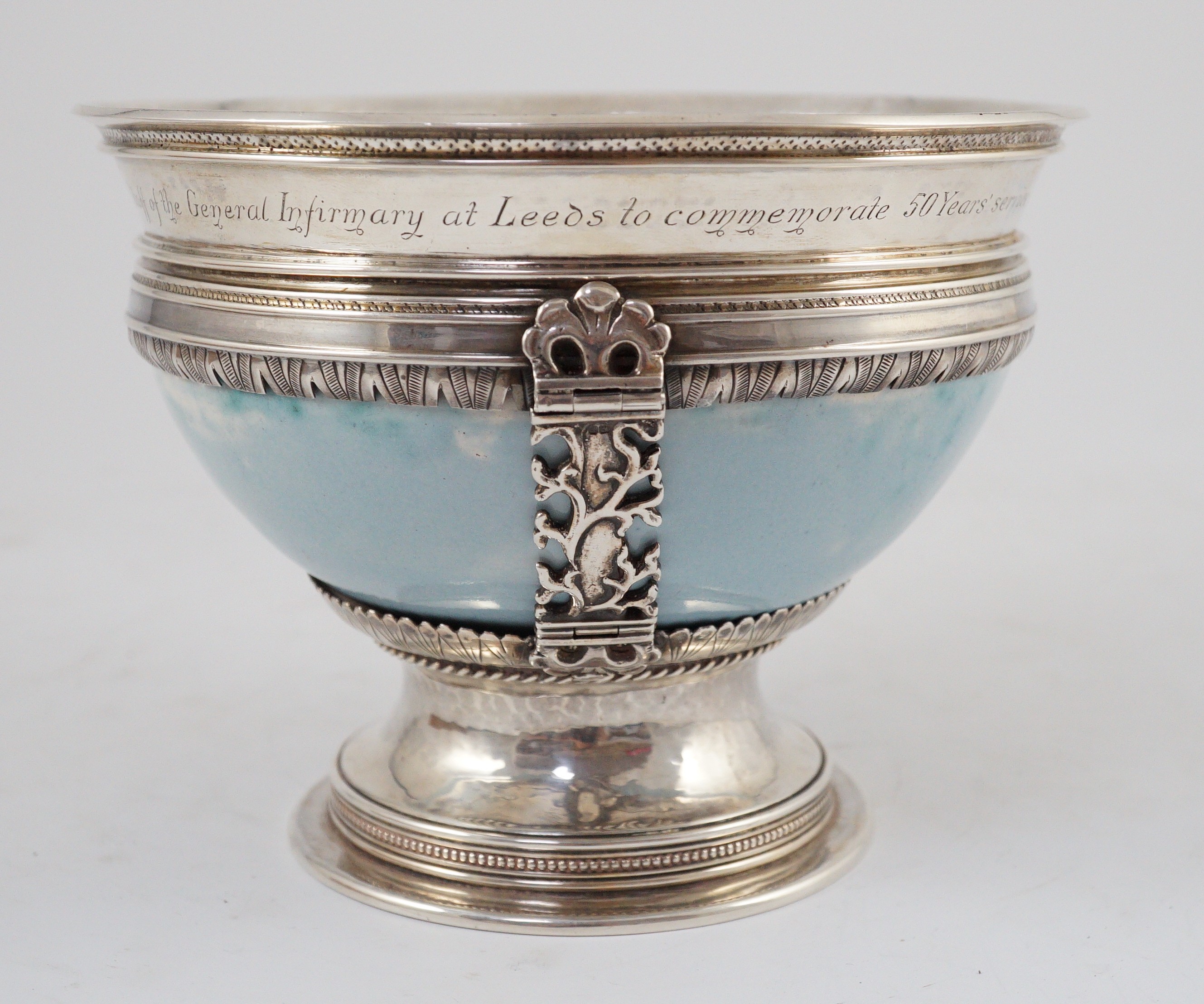 An Arts and Crafts silver mounted Ruskin pottery pedestal bowl, the silver mounts by A.E. Jones, Birmingham 1929, 16.5cm diameter